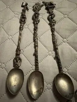 Italian silverplate decorative spoons with figural handles. Set Of 3