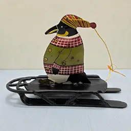 Foreside Primitive Metal Penguin Riding Sled Toboggan Sweater Whimsical Hanging