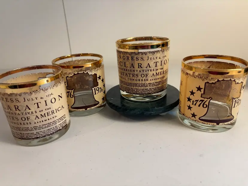 Four glorious gold rimmed bicentennial cocktail glasses. These 4 glasses feature the Declaration of USA.
