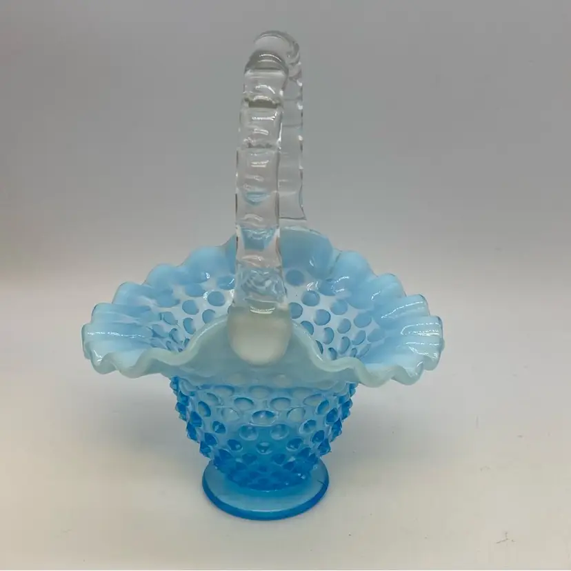 #0234 Fenton blue opalescent hobnail glass basket with ruffled edge and bamboo handle. 6” x 4.5”