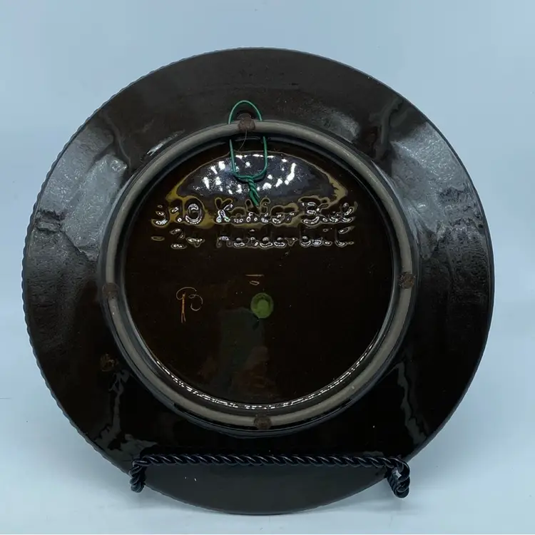 Hand-painted Kohler Biel decorative folk art plate featuring a girl and a cow.