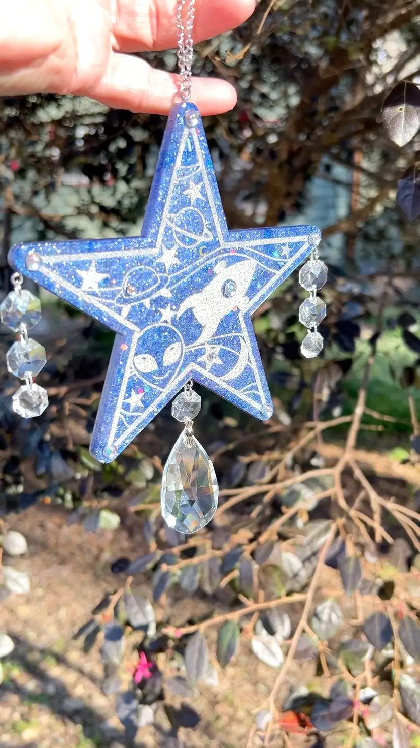 Cosmic Suncatcher! Amazing Handmade By Me! 🫶 Hanging Star With Alien👽 & Rocket 🚀 On A Blue Star Field. Swarovski Chandelier Crystals. Made With Resin and Glitter. 10” Drop. 5-1/2” Star.
