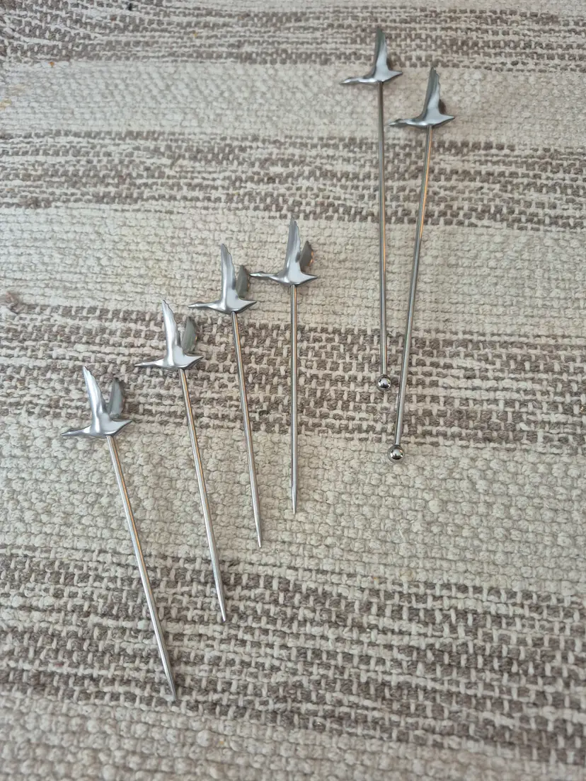 Grey goose cocktail swizzles and olive picks