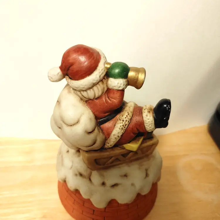 Santa on sled with bell. Music box.