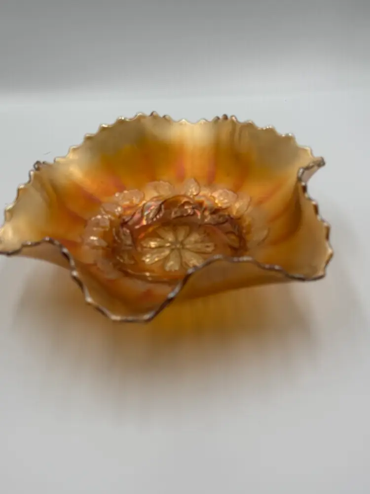 Dugan “Diamond cosmos”  9 in ruffled fruit bowl in marigold carnival glass