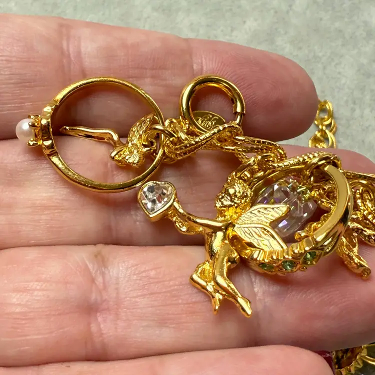 Vintage Kirk's Folly Thirteen Charms 10" Adjustable Gold Tone Bracelet Cupid Fairies