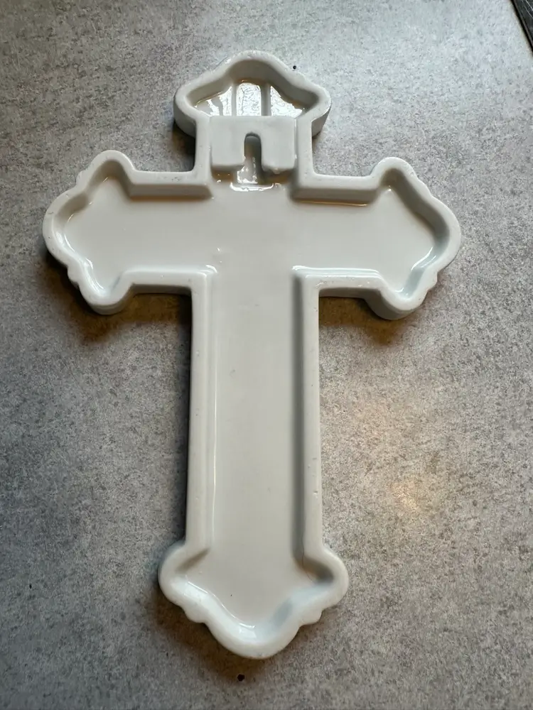 Porcelain decorative cross with hand-painted violet flowers.