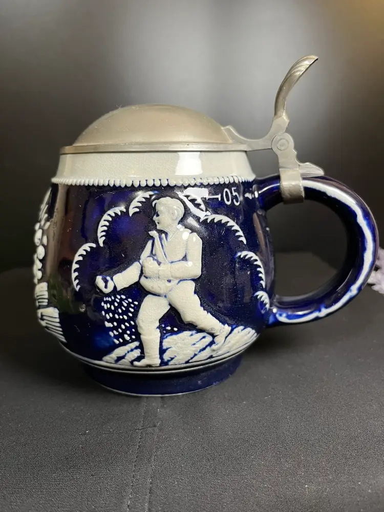Squat Round Beautifully crafted Cobalt Blue Beer Stein. Makers Mark is RM G #3824 P. Depicts "Sowing & Reaping" Wheat-Lot 61