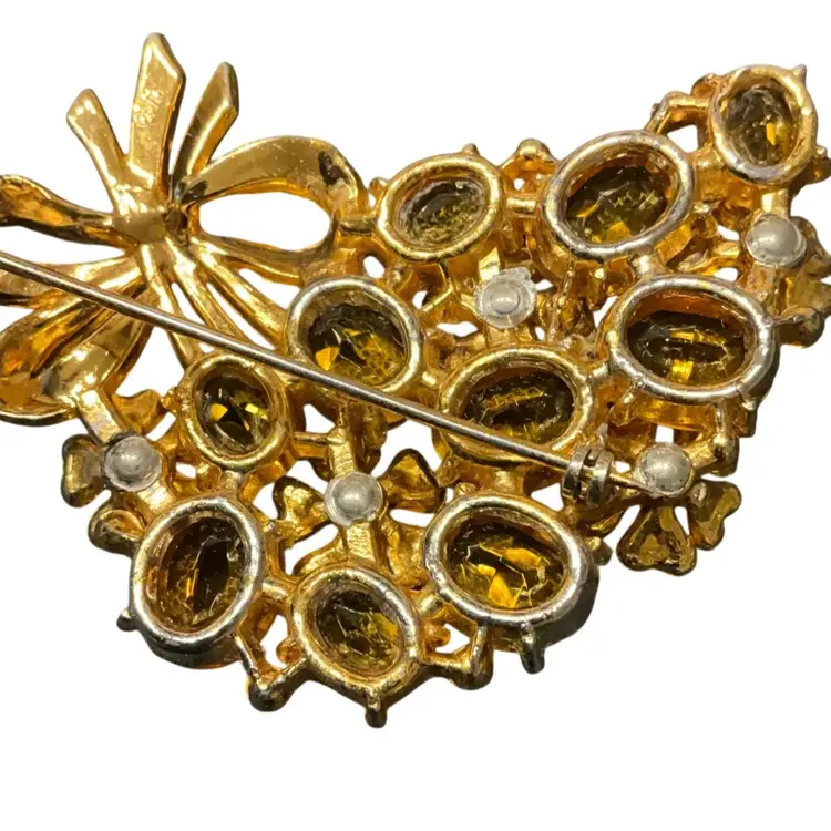 Unsigned Citrine Brooch With Gold Bow. Measures 2.5”x2”.