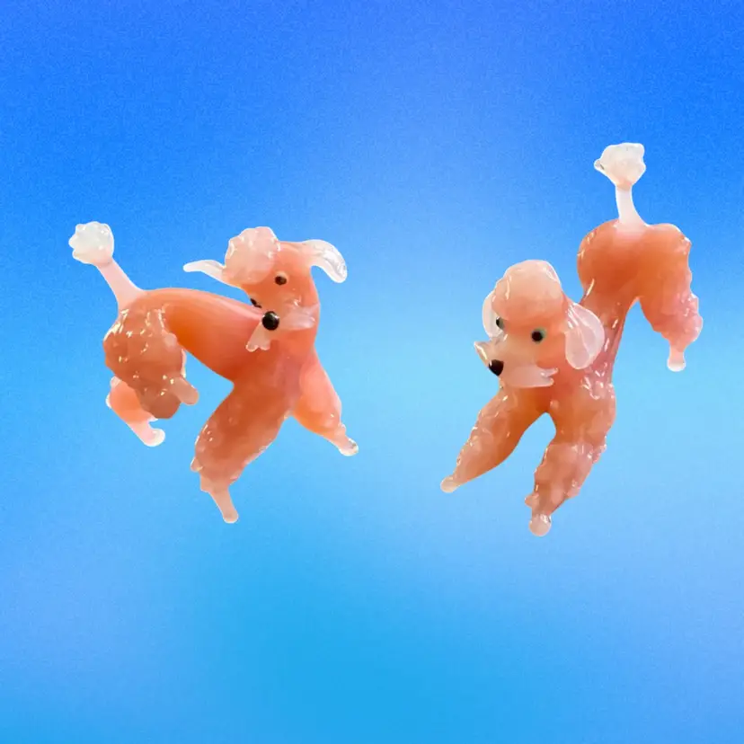 A Pair Of Vintage Pink Glass Poodles