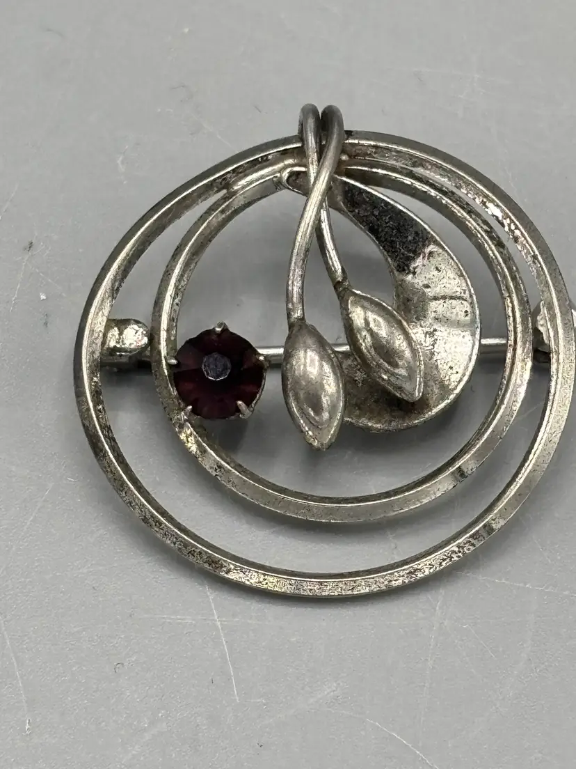 Vintage Sterling circle brooch with Garnet stone