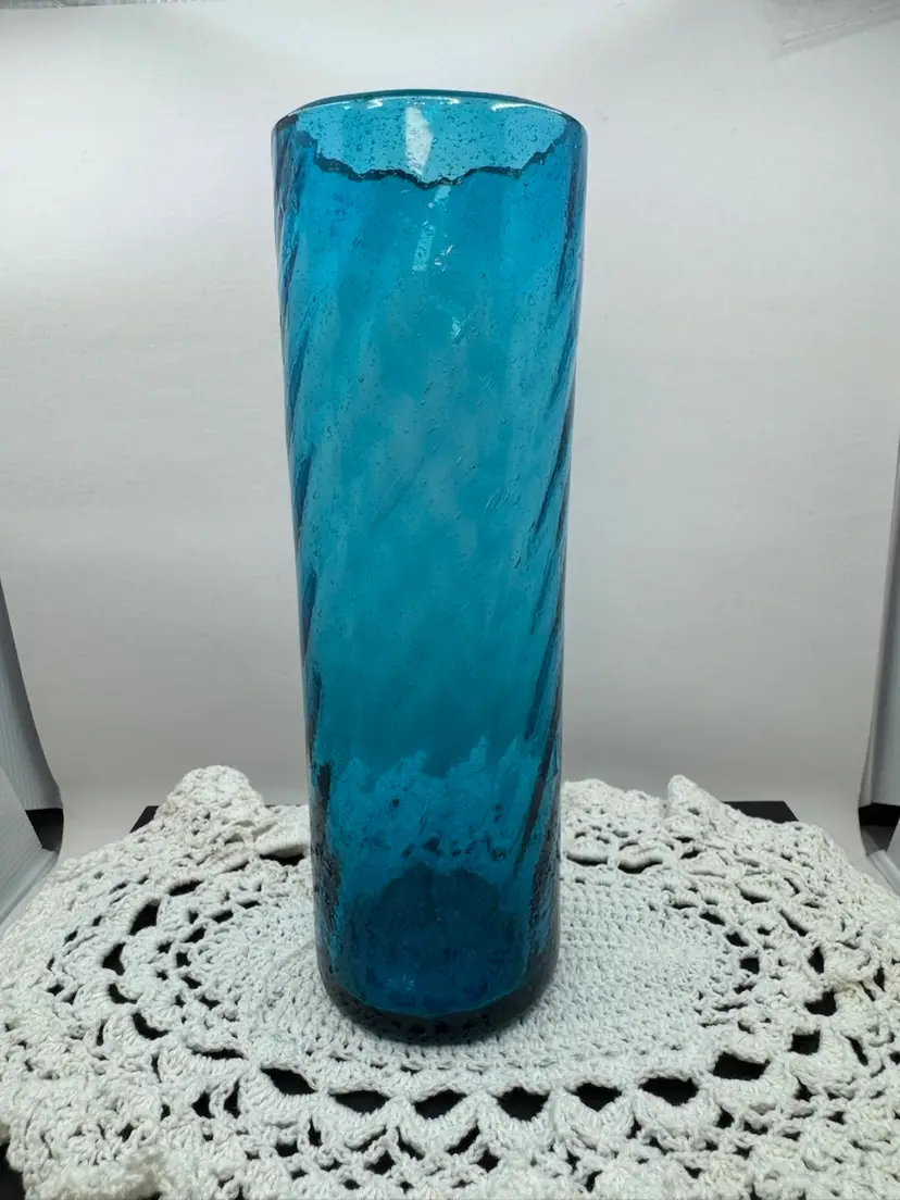 Blue hand-blown art glass vase with swirl pattern and air bubbles, 8.5”