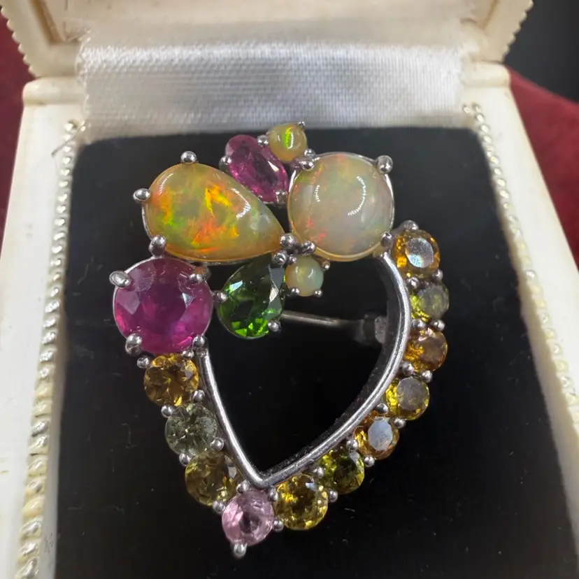 Silver Brooch - multi-colored gemstones, including opals, tourmaline, and rubies