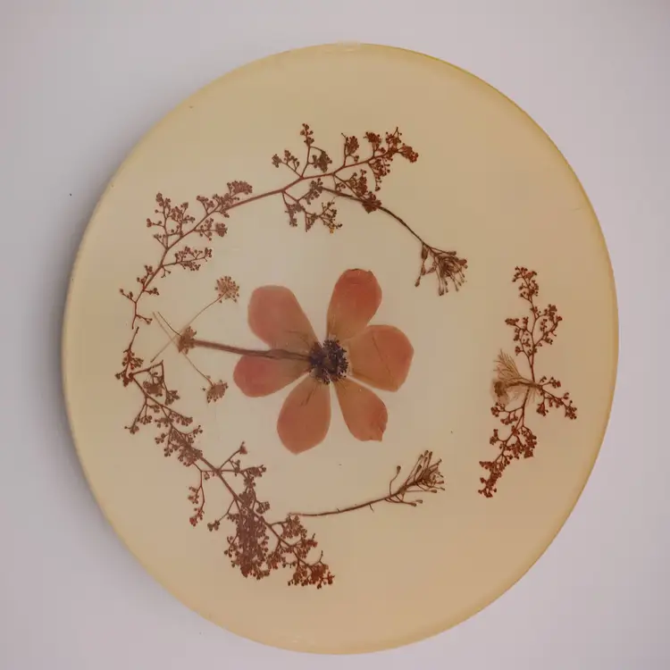 Vintage lucite trivet with dried flowers