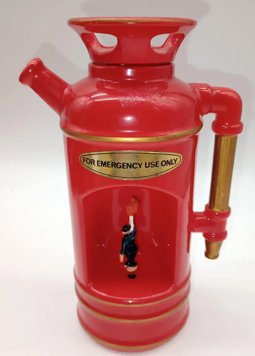 Vintage, Liquor Decanter ,Reusable With Original Plastic Stopper In Spout.
This Musical Fire Extinguisher Is Definitely A Great Conversation Piece When Plays" How Dry I Am". It Is Made In Japan And Measures 8.75 Inches In Height By 6 Inches In With.