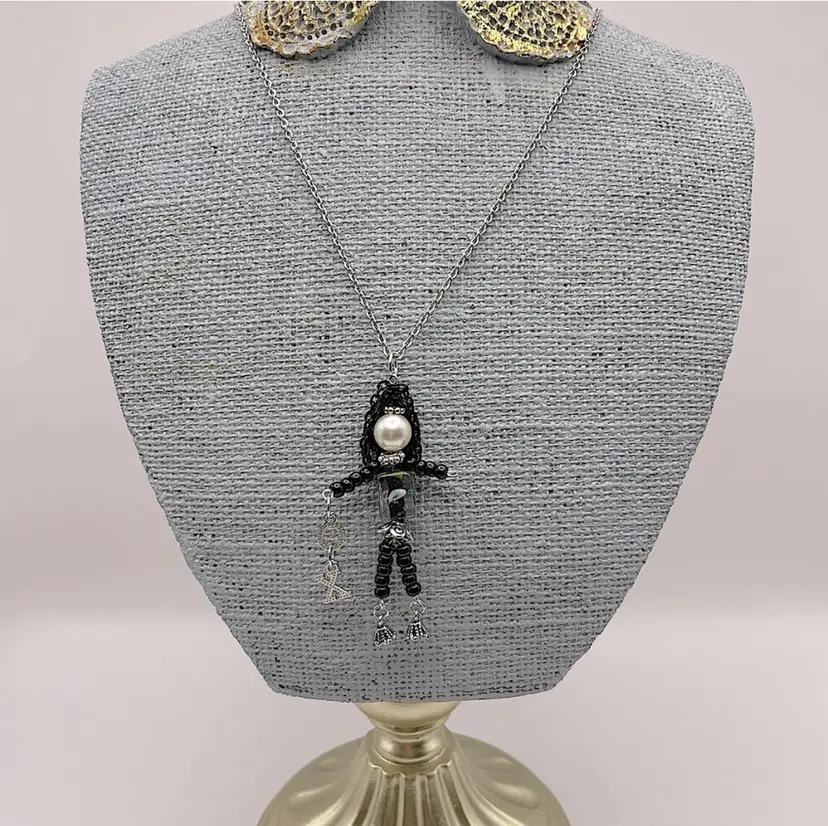 Handmade, Silver Metal/Beaded Girl Pendant, Faux Pearl, Glass Body, Black Chain Hair, Holding “X” And “O”