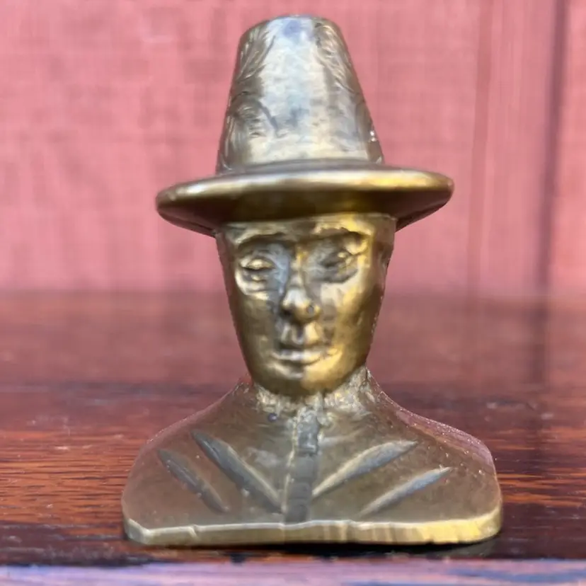 Brass Snuffer. Man In Hat With Floral Design. Stamped China.