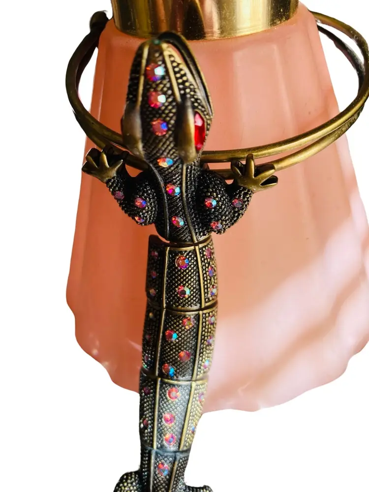 Vintage Salamander - Bronze Brass Set With Aurora Borealis AB Crystals - Slave Bracelet - Jointed - I Showed The Bottom So You Could See The Joints Are Held Together With Strong Springs - High End Designer But It’s So RARE I Couldn’t Find Any Information On It - The Jaw Is Hinged So It Will Open & Close - Absolutely STUNNING!  RARE!  HTF! 
Length of Salamander: 7.5”
Diameter Inside of Bracelet: 2.5” But It Is Brass Therefore It Is ADJUSTABLE. 
Ring: You Can Pick Which Finger The Ring Fits The Best On But The Ring Is Adjustable Just Like The Bracelet Is.