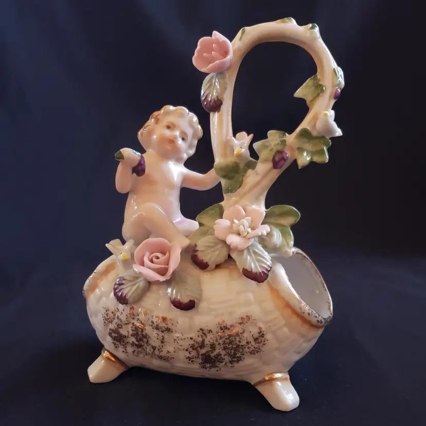 Figurine UCAGCO Porcelain Hand Painted Child on Vase Tube Of Flowers Vintage