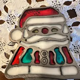 Vintage cast iron and stained glass Santa Claus votive candle holder.