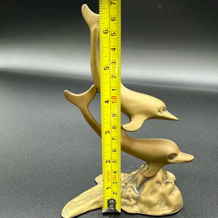 This is a mid-20th century 2 brass dolphins sculpture. 7” Tall, MCM
