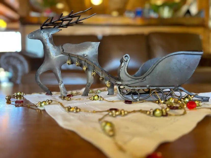 Hand-welded & riveted Antique Primitive Metal Reindeer Pulling Sleigh with Handcrafted Brass Bells - Table Top or Holiday Christmas Planter Decoration