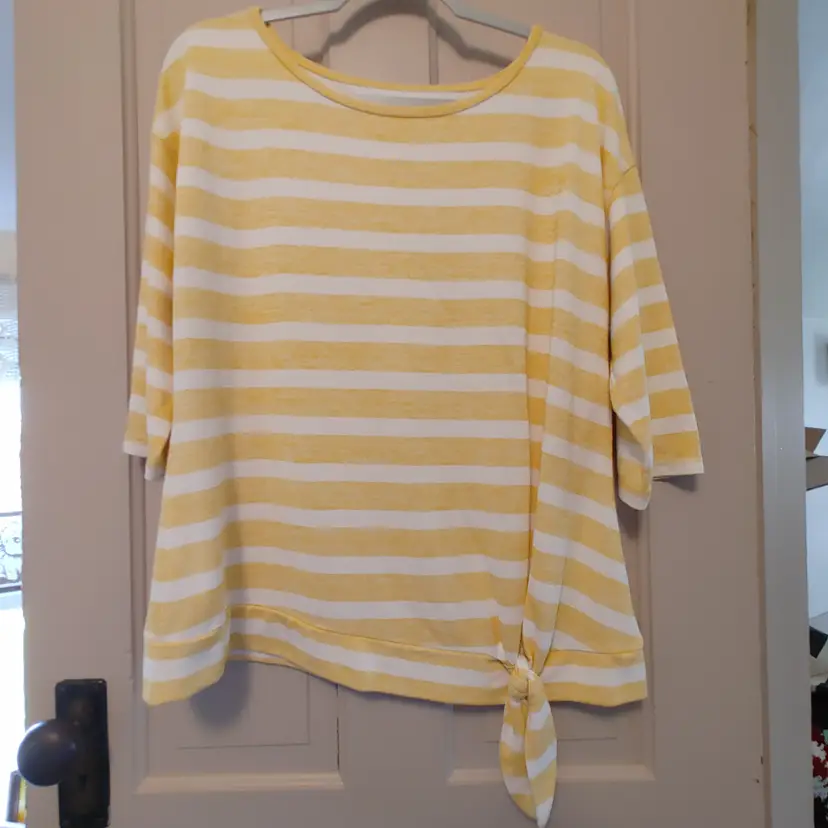 Top- Brand: T by Talbots. Size Large. Yellow and white striped top. Material- 48% rayon, 48% polyester, 4% spandex. No callouts.
