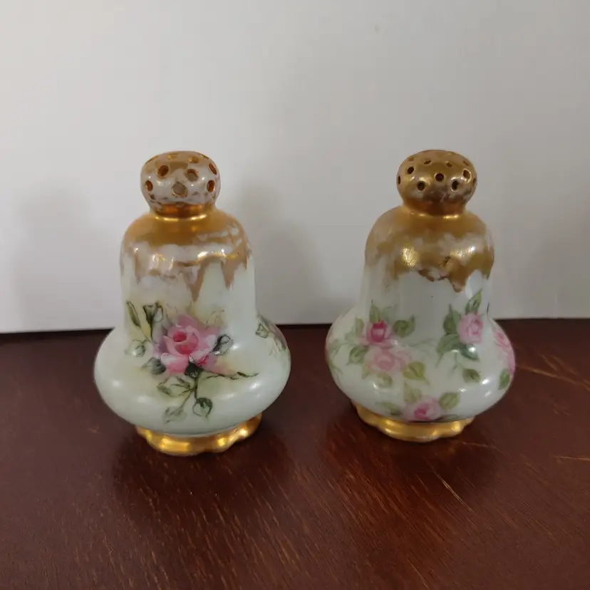 Salt & Pepper shakers. Not exact set. Missing stoppers. 3 inches high. Porcelain.