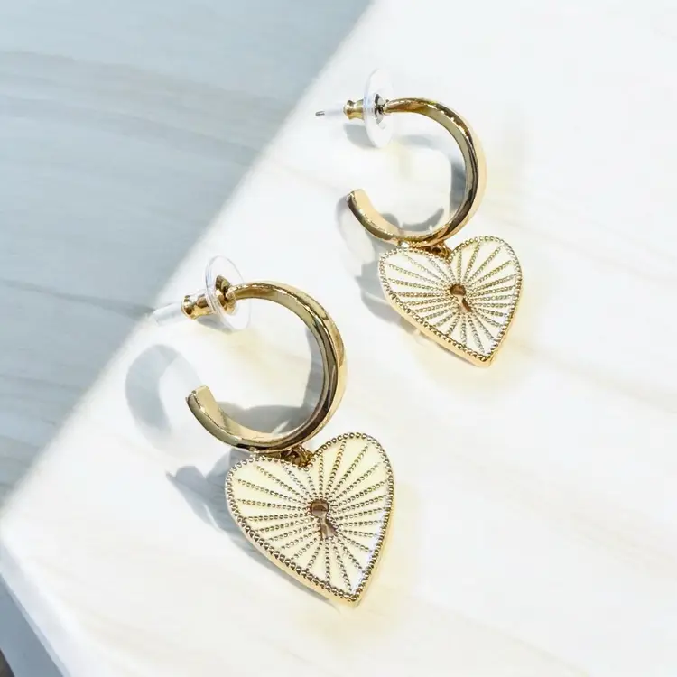 Gold hoop  earrings with heart shaped Charms attached