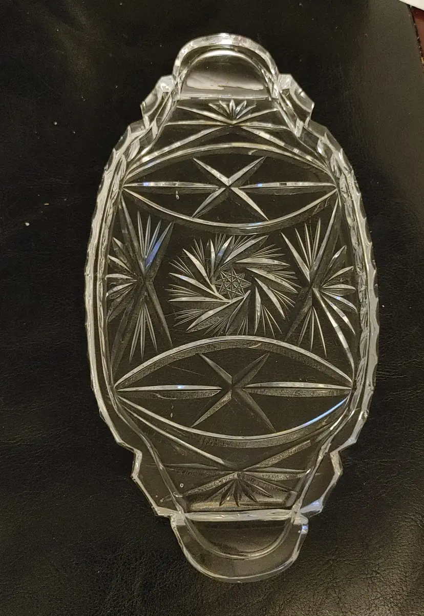Crystal relish tray or trinket dish. 9.75 x 5. Small scratch and chip. See pics.