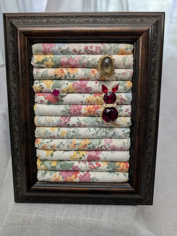 Repurposed Plastic dark wood toned Frame to hold rings or brooches
