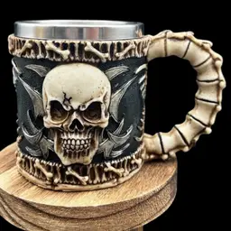#238B Premier Exhibitions Evil Grinning Tribal Skull Mug With Skulls. Skeletal Spine Bones HandleResin With Stainless Insert