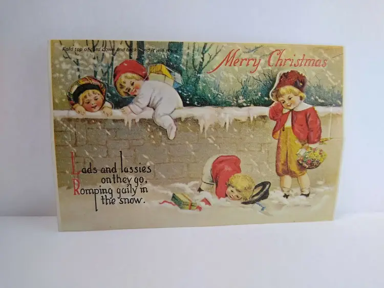 Christmas Postcard Die-cut Fold Over Lads And Lassies In The Snow Merrimack 1981