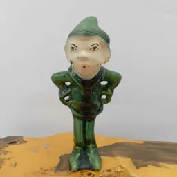 Judgey looking elf figurine, pixie, standing, green, vintage