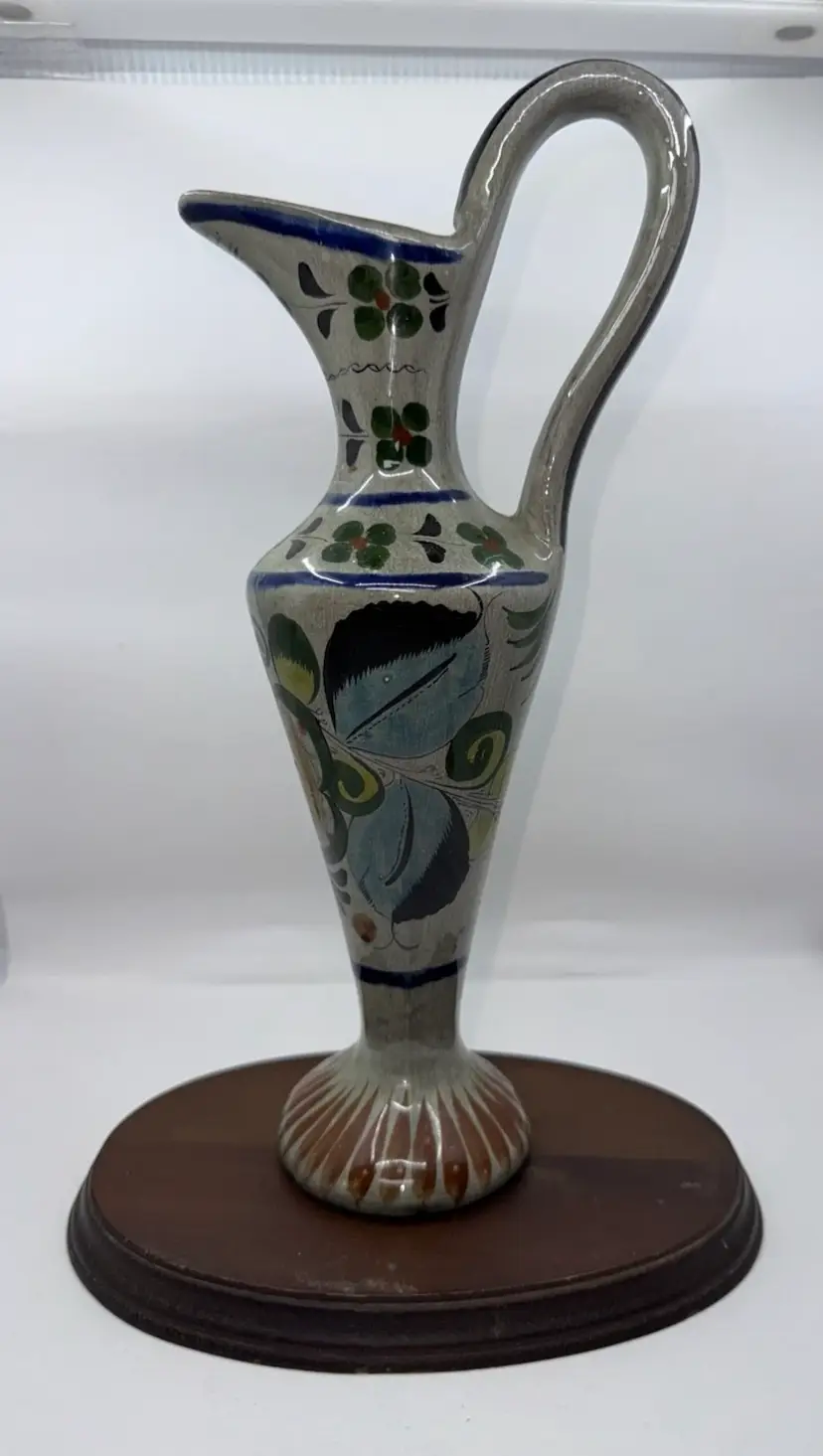 Hand-painted Mexican ceramic ewer with floral motifs, 12”x5.25”
