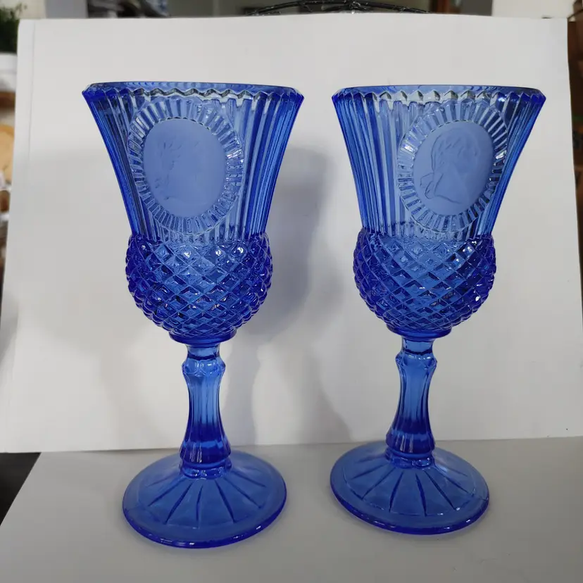 Cobalt blue goblet set. Avon produced by Fostoria. Features George Washington cameo. 8 inches high. No chips or cracks.