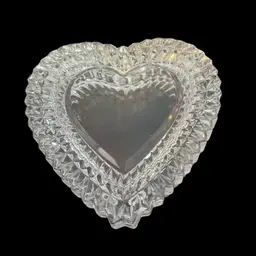 A faceted lead crystal heart-shaped trinket box  not marked, possibly Cristal d'Arques.
4” x 1.5”