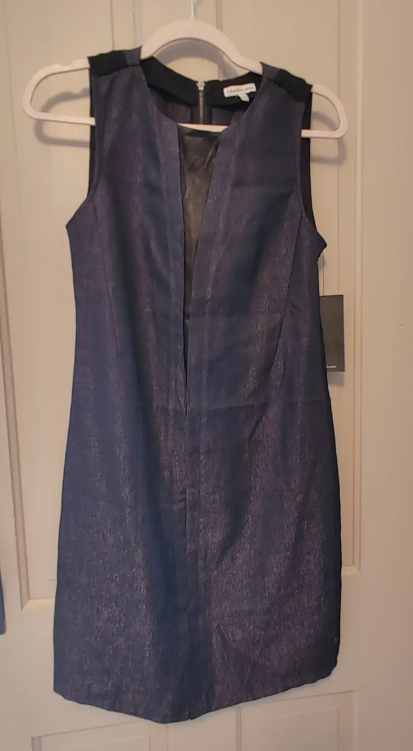 Dress- Brand: Calvin Klein Jeans. Size XS. NWT. Retail $89.50. Black dress. Material: 80% rayon, 20% nylon. No callouts.