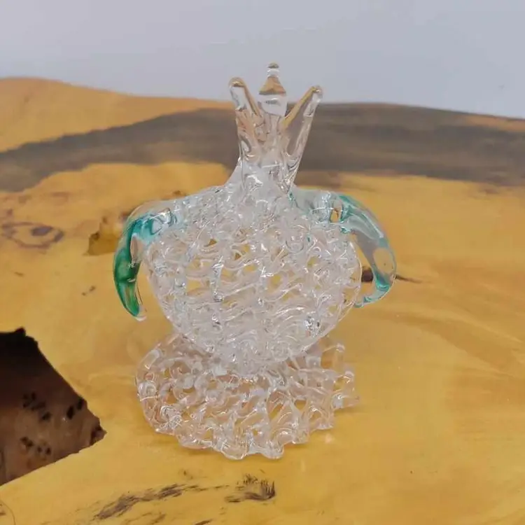 Hand blown spun glass bird on fruit (?)/ flower (?), figurine