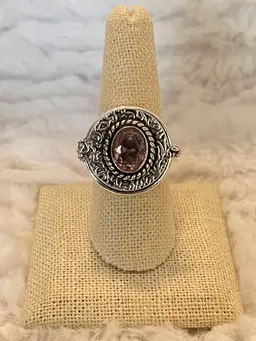 Pink “poison” ring with hinged clasp.