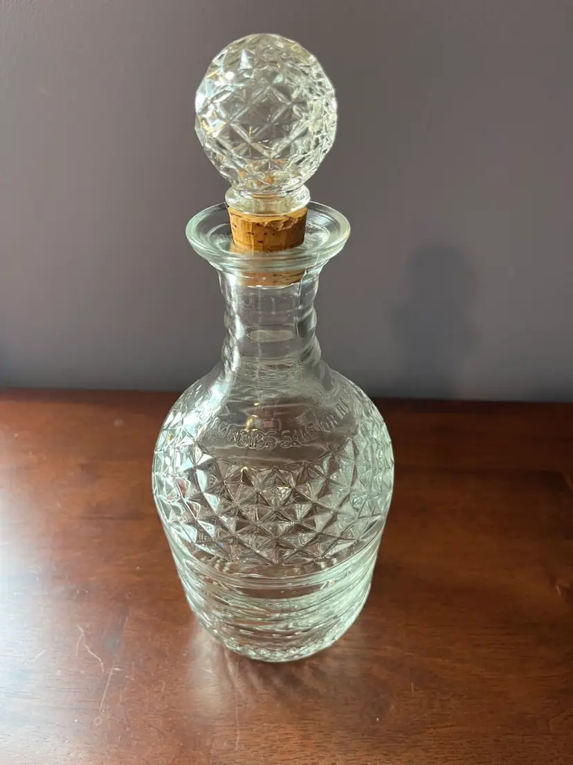 Vintage pressed glass liquor decanter with diamond pattern and faceted stopper. 10.5” Tall  Circa 1940-1950