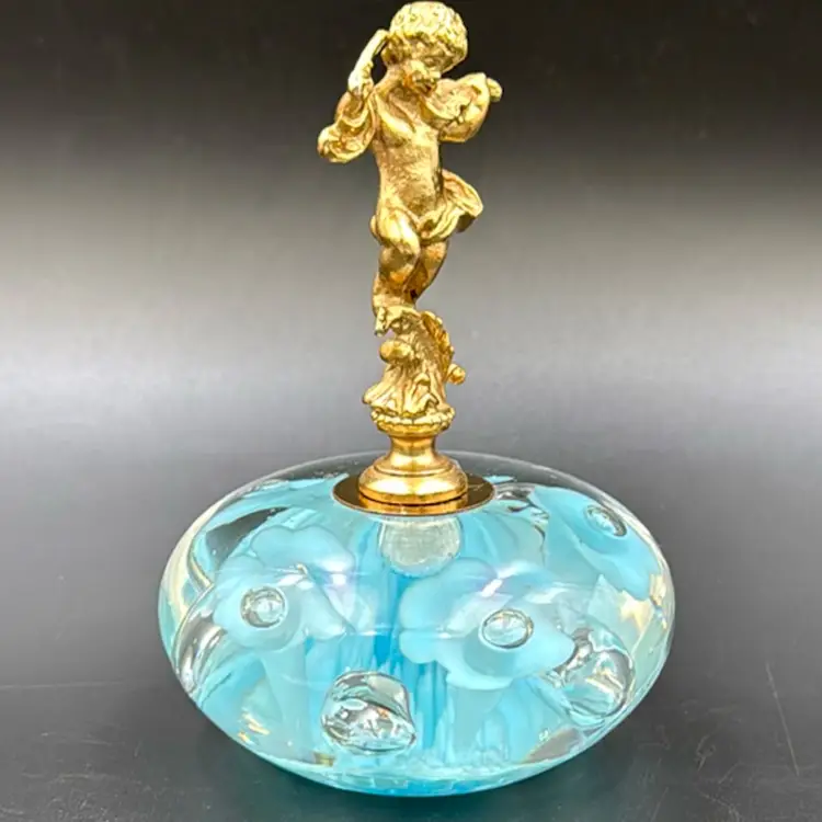 Vintage baby blue art glass trumpet flower paper weight Married Italian gold tone cherub With Paper Weight.
