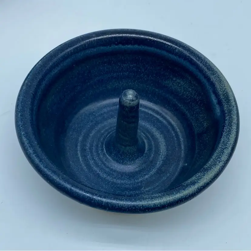 #2215 Handmade dark blue studio art pottery apple baker with central spindle.