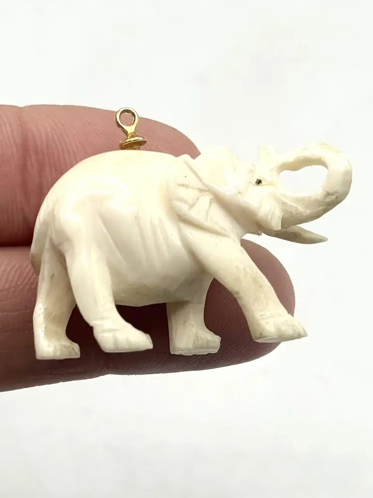 Estate carved figural elephant charm pendant