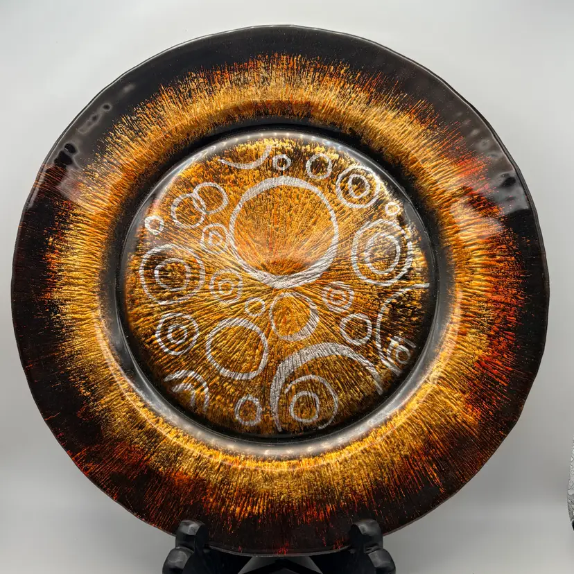 Contemporary decorative art glass plate - black, silver, gold, and brown swirling pattern