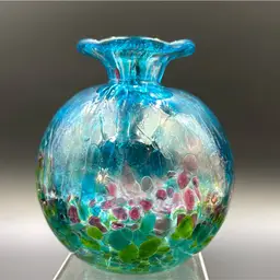 Multicolored art, glass bud face very unique