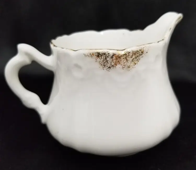 Antique Pair of Porcelain Creamers