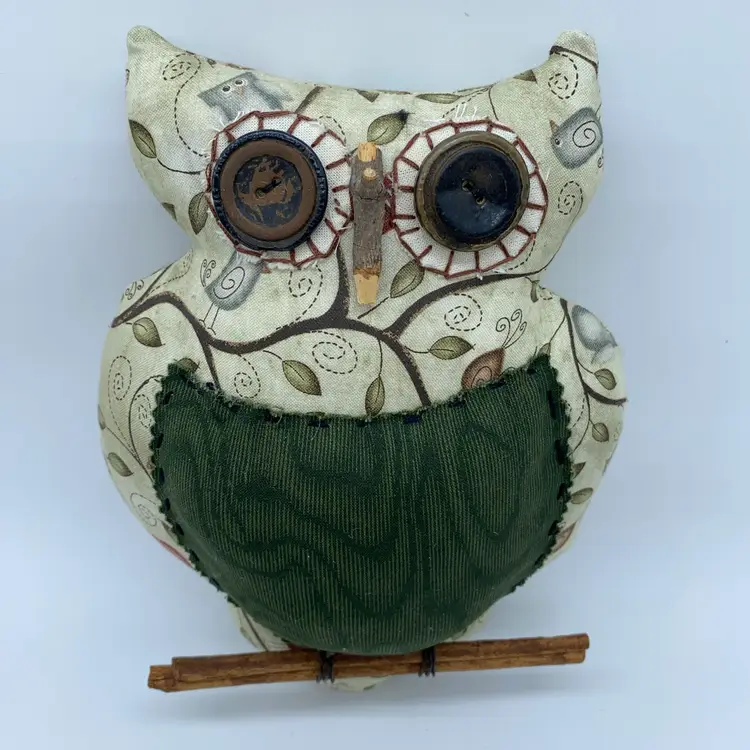 #2603 fabric owl ornament with button eyes and a twig perch.