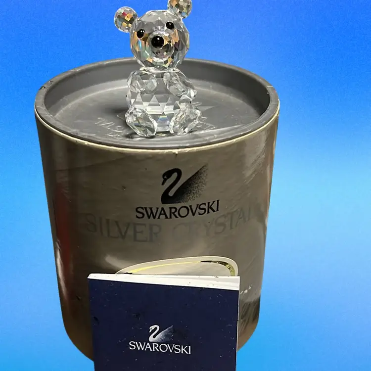 A faceted crystal teddy bear figurine by Swarovski with original packaging. Great Christmas Gift Idea