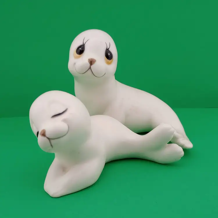 Pair of ceramic seal figurines
